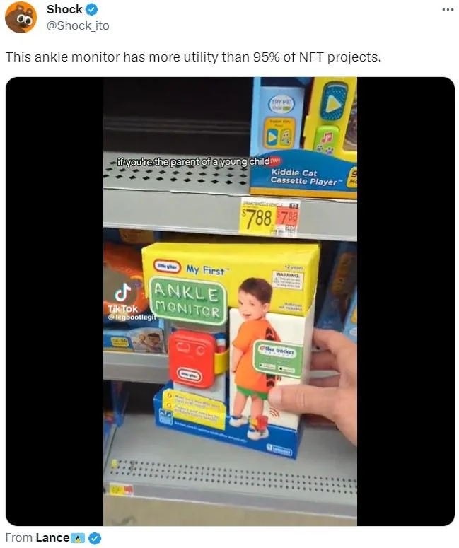 My First Ankle Monitor — Tweet by @Shock_ito comparing the ankle monitor toy to NFT utility, showing the toy on a store shelf.