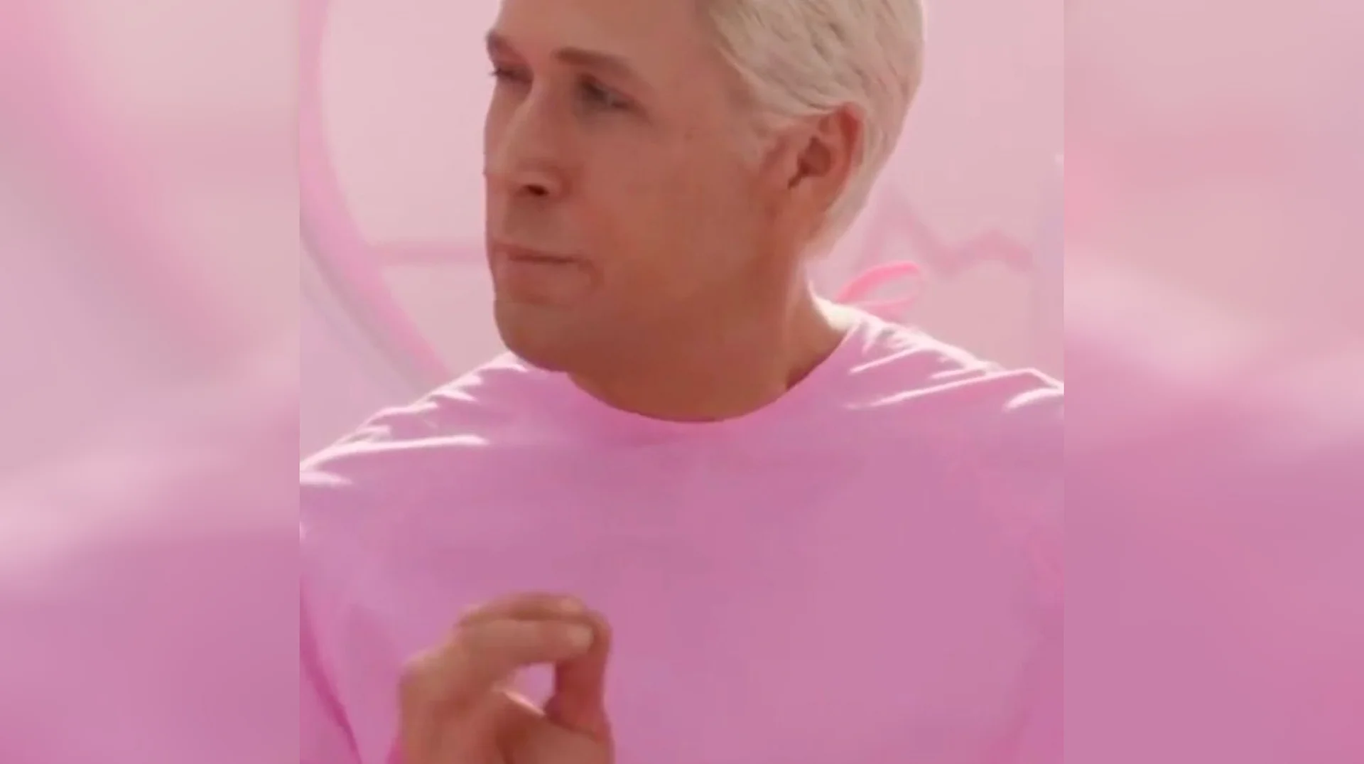 My Job Is Just Beach — Ryan Gosling as Ken in pink shirt against pink background in Barbie film still