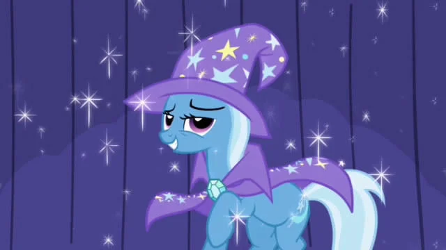 My Little Pony Character Fandom — Screenshot of Trixie unicorn on stage in wizard hat and cape surrounded by sparkles.
