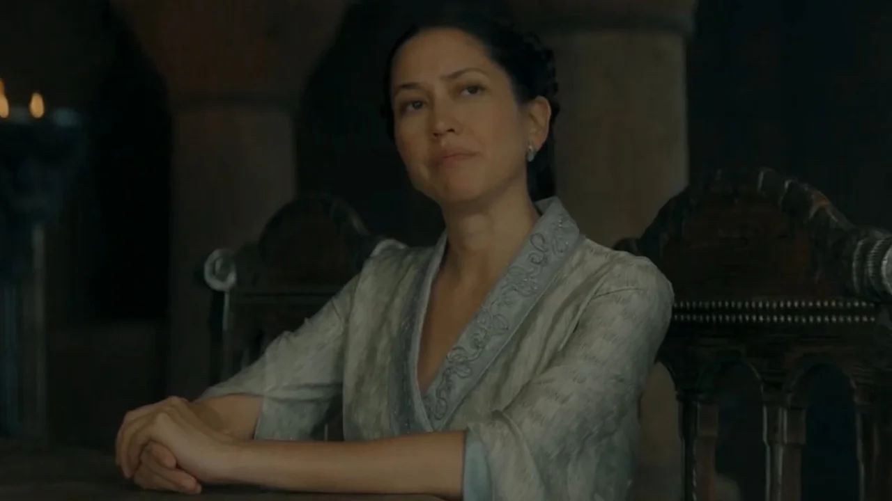 Mysarias Accent Memes Hotd — Mysaria from House of the Dragon seated at a table in grey robes
