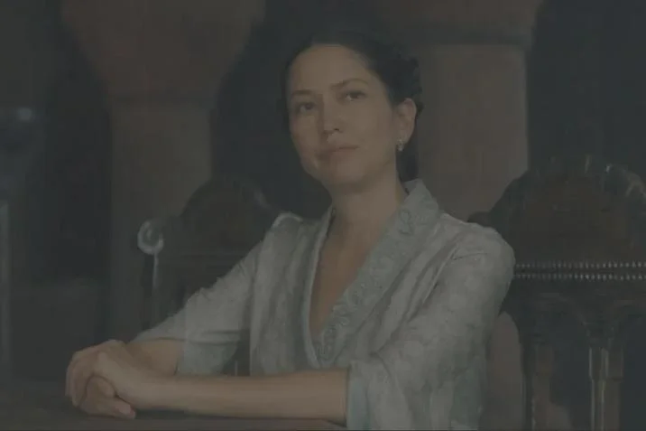 Mysarias Accent Memes Hotd — Slightly blurred screenshot of Mysaria seated in a grey robe from House of the Dragon