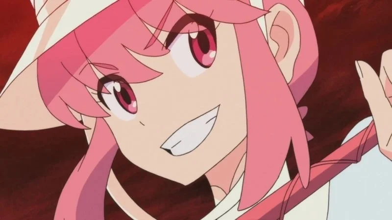 Nani — Nonon Jakuzure close-up with distinctive pink hair, white collar, and confident expression.