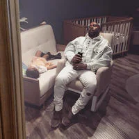 Napping Kanye — The original meme scene capturing Kanye West napping on display furniture with his daughter North West resting nearby at a nursery store.