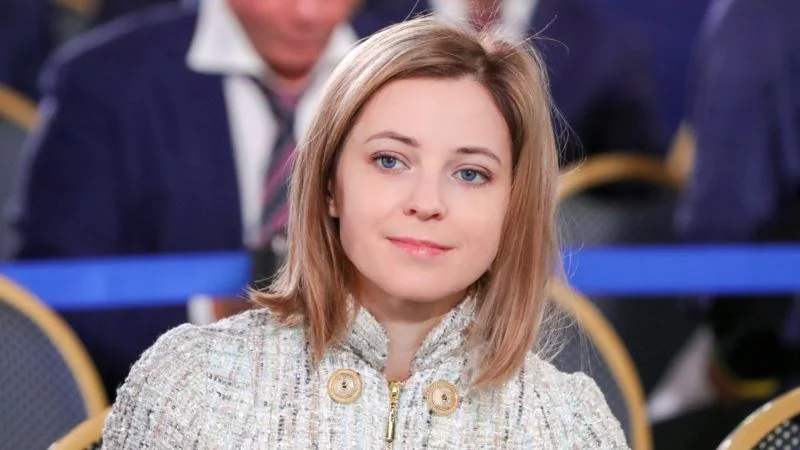 Portrait of Natalia Poklonskaya in a light tweed jacket at a formal event