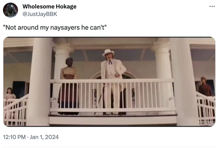 Tweet showing Django Unchained porch scene with caption 'Not around my naysayers he can't'.