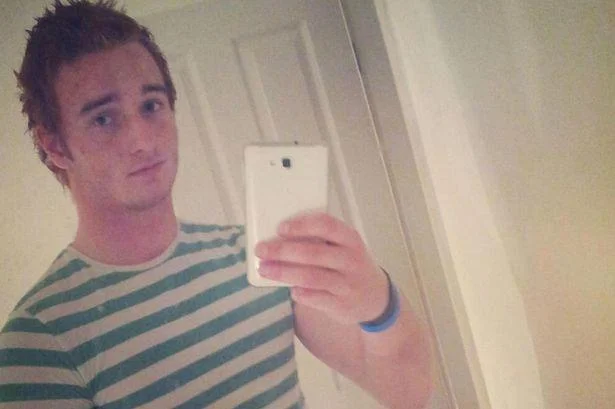 Mirror selfie of a young man in a striped shirt, featured in NekNominate news coverage