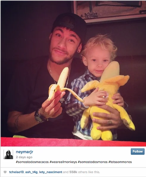 Instagram screenshot of Neymar holding a banana beside a child with a stuffed monkey