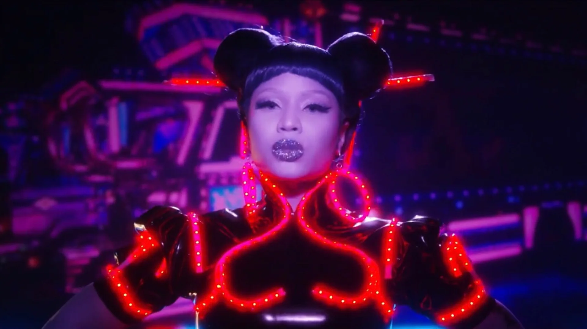 Nicki Minaj's "Chun-Li" — Nicki Minaj wearing double hair buns and a neon-lit black outfit as Chun-Li in her music video.