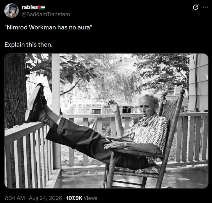 Tweet defending Nimrod Workman's aura with a black-and-white photo of him lounging on a porch