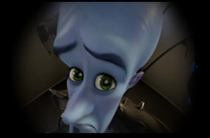 No Bitches — A close-up shot of the Metroman character showing blue alien face with wide eyes and concerned expression.