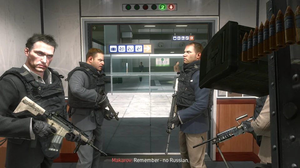 Call of Duty Modern Warfare 2 screenshot of armed men in an airport elevator with subtitle 'Makarov: Remember - no Russian.'