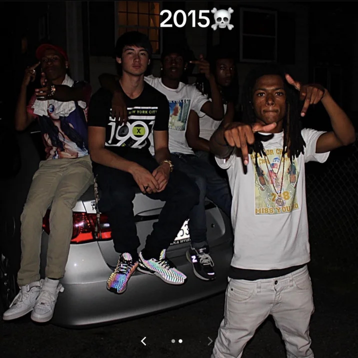 Noah Boat N Em — Noah and friends posing on a car trunk with a 2015 skull-and-crossbones label overlay.
