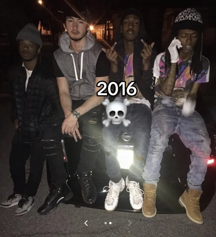 Noah Boat N Em — Noah and friends sitting on a car at night in 2016, flipping off the camera with a skull emoji covering a face.