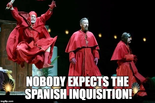 Three inquisitors in dramatic red robes with 'NOBODY EXPECTS THE SPANISH INQUISITION!' text overlay.