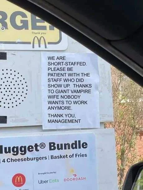 Nobody Wants To Work Anymore — McDonald's drive-through sign with parody text including 'GIANT VAMPIRE WIFE NOBODY WANTS TO WORK.'