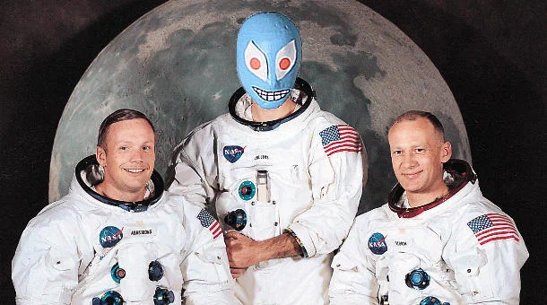 Non Specific Action Figure — Apollo 11 crew photo with Non-Specific Action Figure's head photoshopped onto center figure.