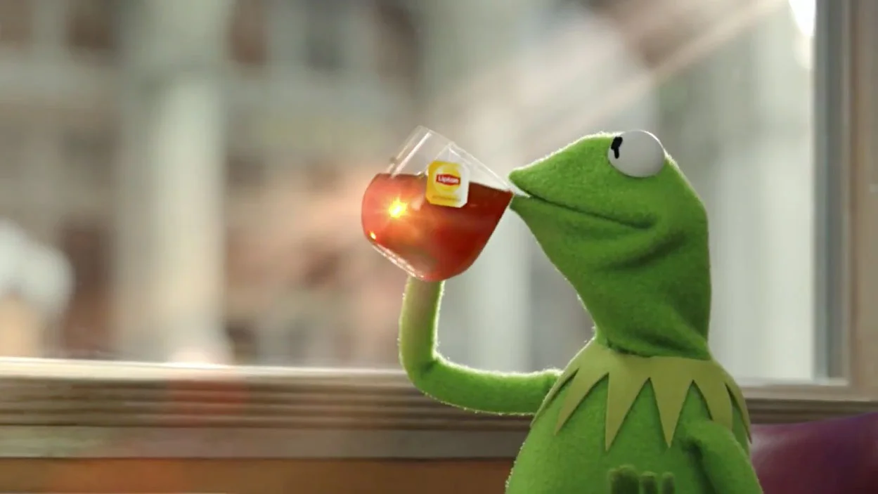Kermit None of My Business — Clean image of Kermit the Frog holding a cocktail against blurred background.