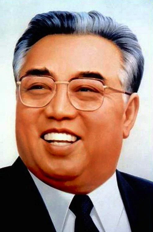 North Korea — Official portrait painting of Kim Il-sung smiling with glasses