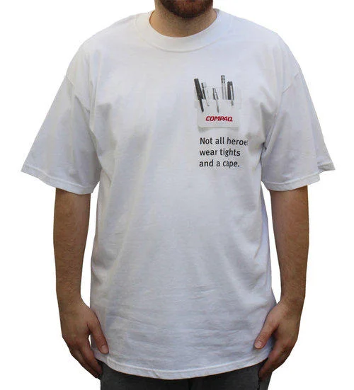 Not All Heroes Wear Capes — White Compaq t-shirt with pocket protector graphic and slogan about heroes