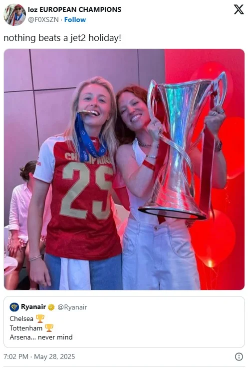 Tweet captioned 'nothing beats a jet2 holiday!' showing two Arsenal fans celebrating with a Champions League trophy.