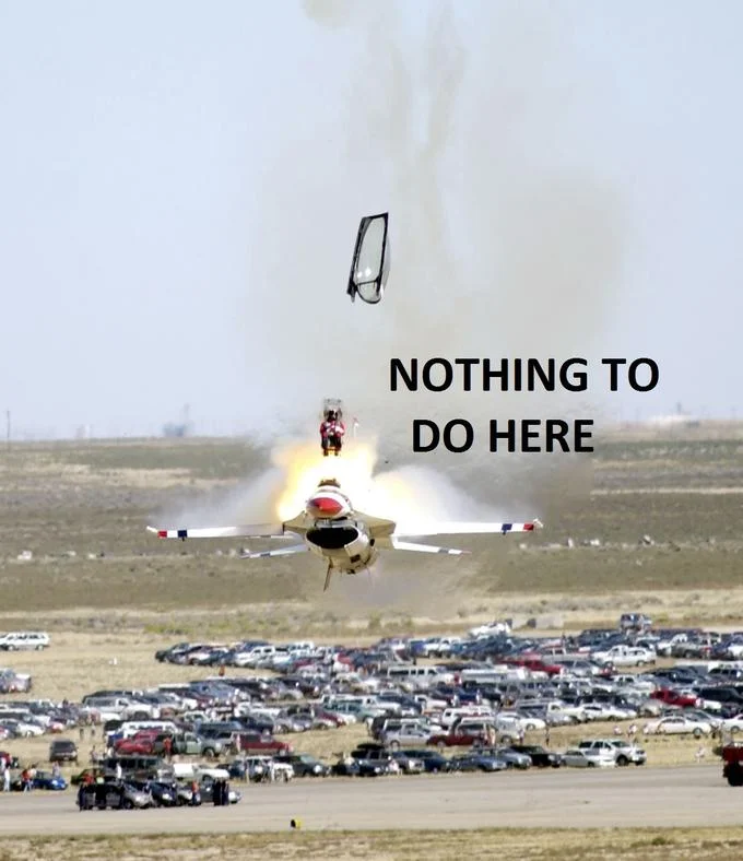 Photo of a fighter jet crashing with ejecting pilot captioned Nothing to do here