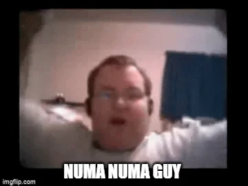 Iconic Numa Numa character seated at computer in distinctive pose with text label.