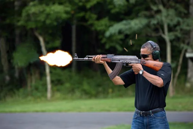 Obama Skeet Shooting Photo — Parody edit swapping shotgun for AK-47 with dramatic muzzle blast and ejected casings.