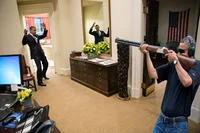 Obama Skeet Shooting Photo — Photoshop parody transposing skeet shooting scene to White House Oval Office.