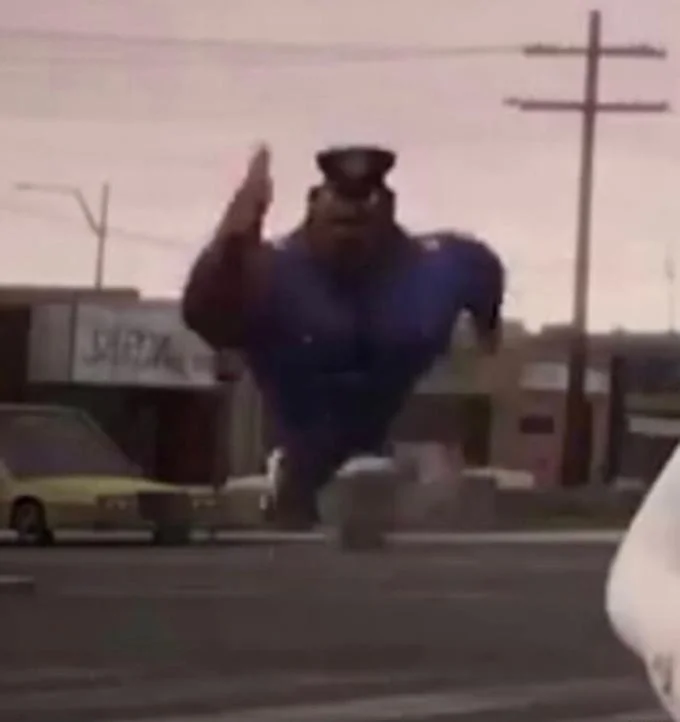 Running Officer Earl — Higher resolution vertical screenshot of Officer Earl running toward the camera