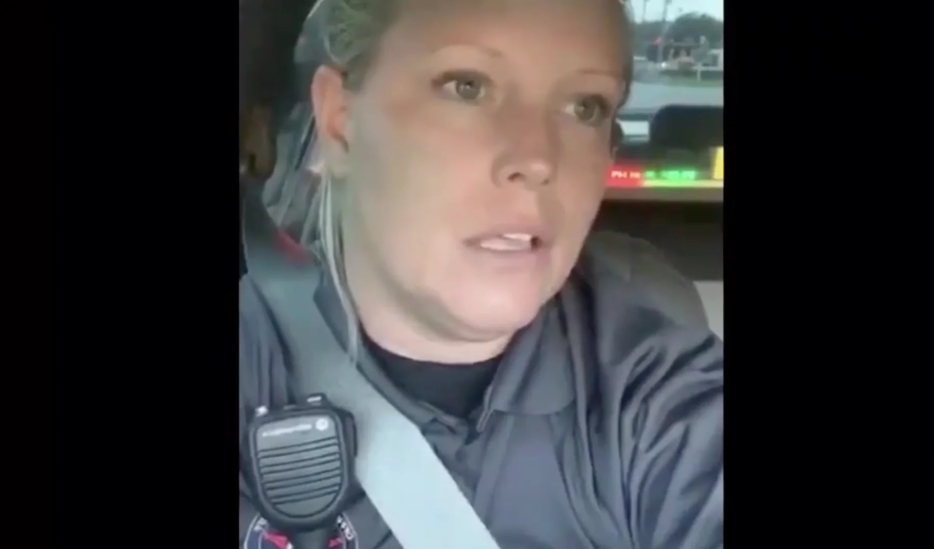 "Officer Karen" McMuffin Meltdown — Teary-eyed female police officer in uniform recording a selfie video inside her patrol car outside a McDonald's.