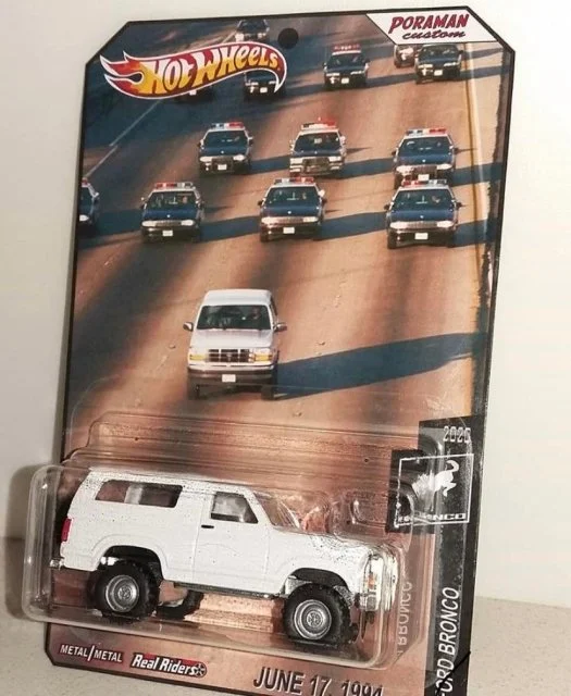 O.J. Simpson Murder Trial — Hot Wheels custom Bronco toy packaged with imagery of the OJ Simpson police chase