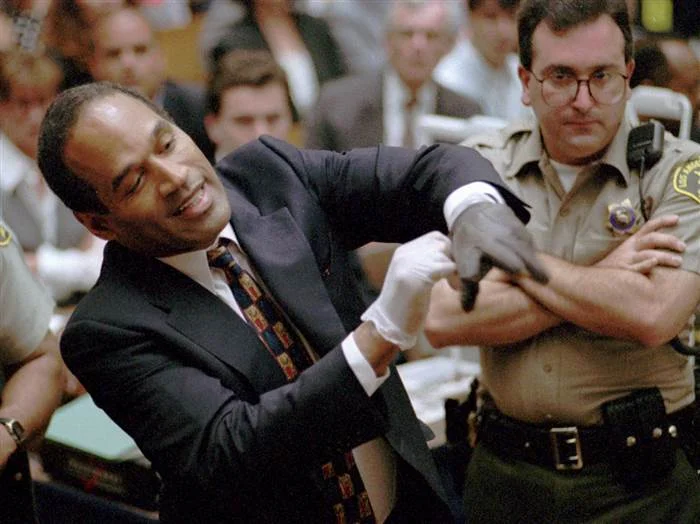 O.J. Simpson Murder Trial — OJ Simpson putting on a black glove during his murder trial