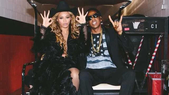 Ok Hand Sign — Photo of two women making hand gestures with unclear canonical ok sign position.