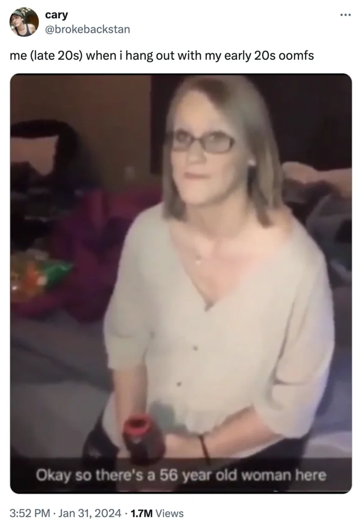 Okay So There's a 56 Year Old Woman Here — Tweet from cary @brokebackstan about feeling old around younger friends, with the 56 year old woman meme image