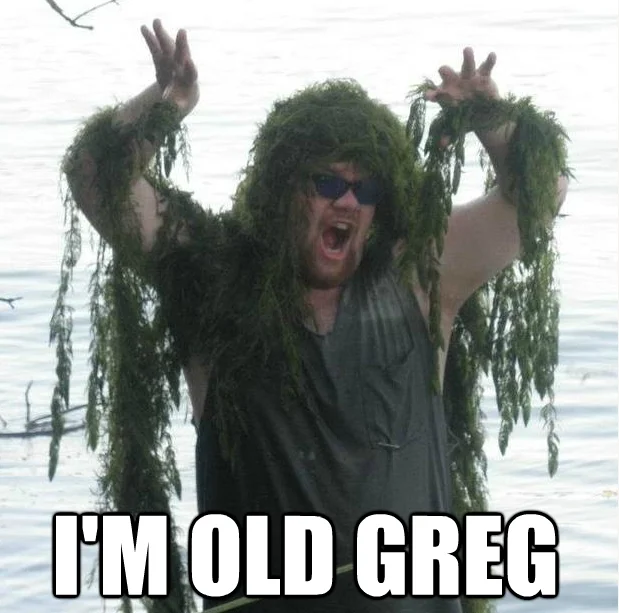 Old Gregg — Bearded man in sunglasses draped in seaweed by a lake with caption 'I'M OLD GREG'