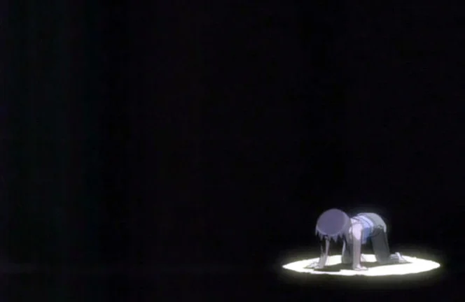 Anime figure kneeling in orz pose under spotlight in darkness