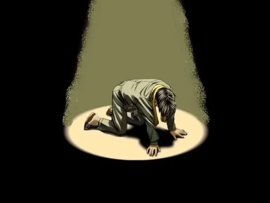 Manga man kneeling in orz pose under dramatic spotlight