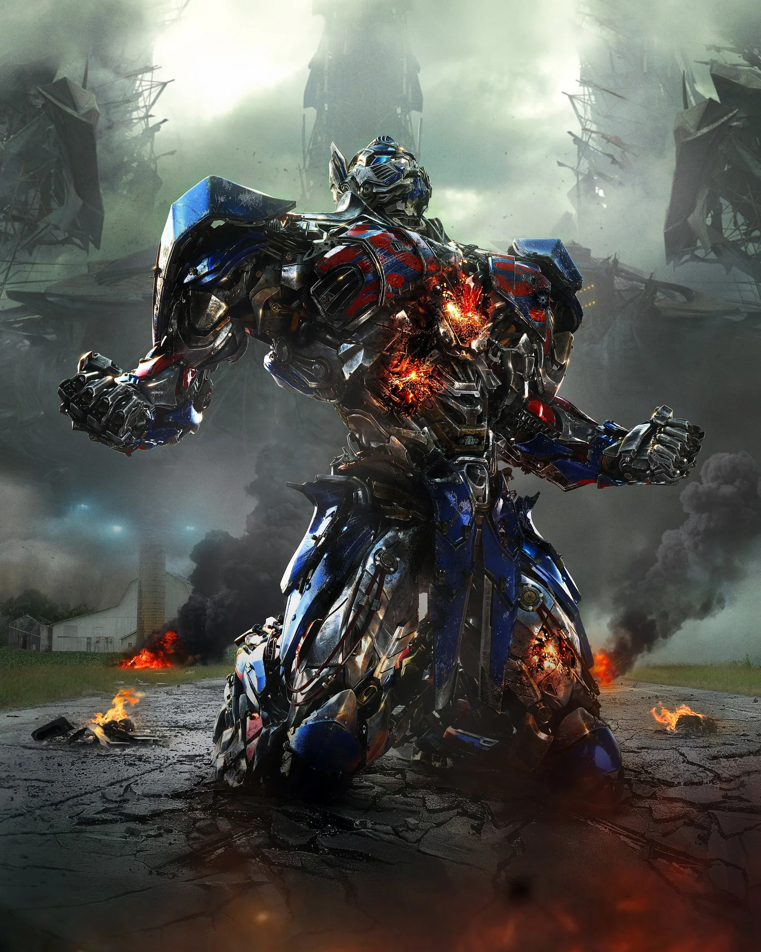 Overly Upset Optimus Prime — High-resolution promotional image of damaged Optimus Prime crouching in a burning field
