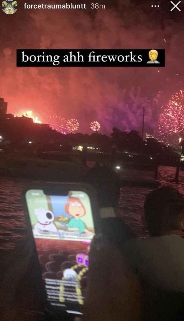 Boring Ahh Family Guy Episode — Instagram story of fireworks over water with a phone playing Family Guy, captioned 'boring ahh fireworks'