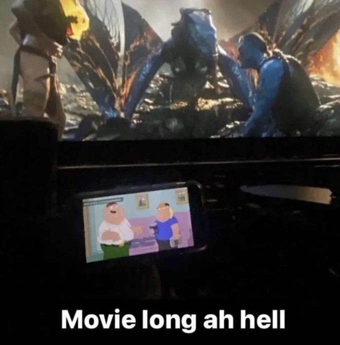 Boring Ahh Family Guy Episode — Avatar movie playing on a cinema screen with a phone showing Family Guy in the foreground, captioned 'Movie long ah hell'
