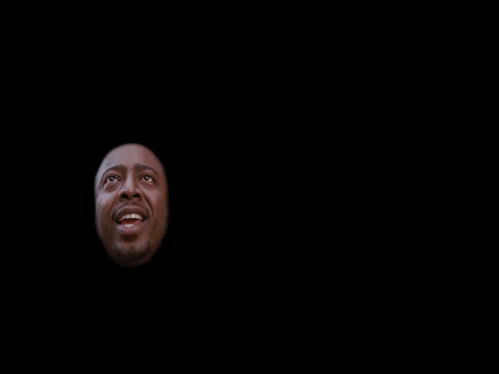 P1ZZ4 GUY — Isolated Donald Faison smiling face on black background