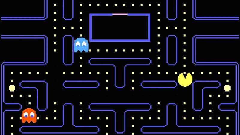 Pac-Man arcade gameplay screenshot with maze, dots, and colored ghosts
