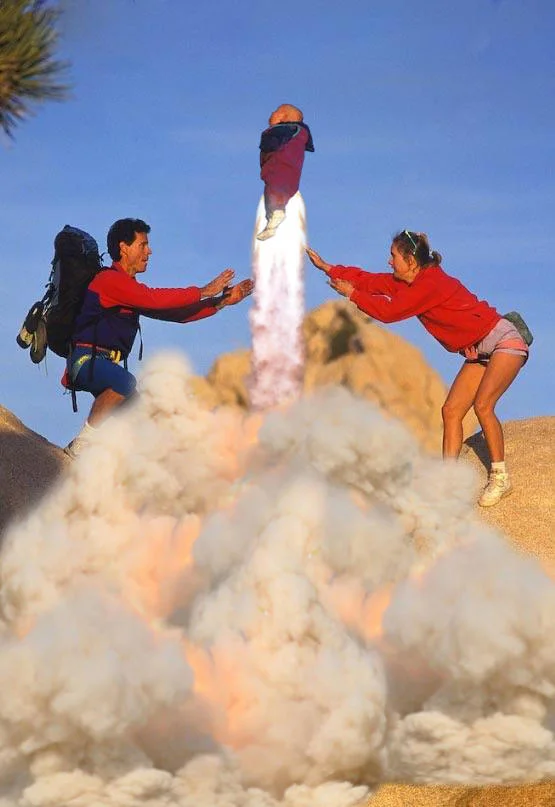 Parents Throwing Baby — Baby depicted as a rocket launching between the two parents
