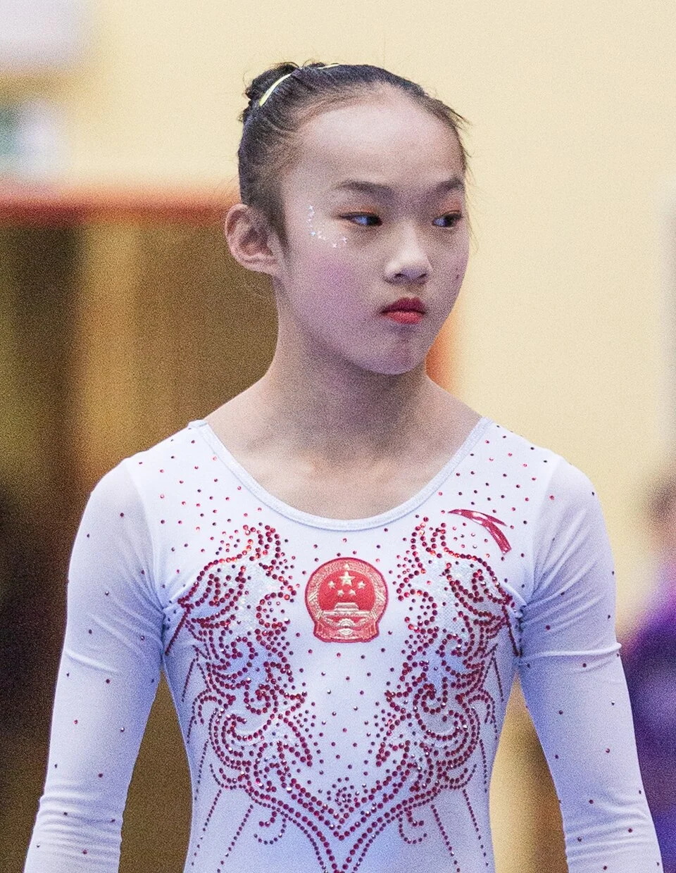 Paris Olympics Memes — Clean photograph of young Chinese gymnast in competition attire during Paris 2024 Olympics.
