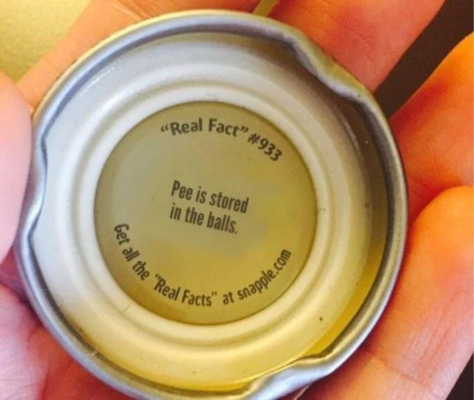 Snapple bottle cap doctored to read 'Real Fact #933: Pee is stored in the balls.'