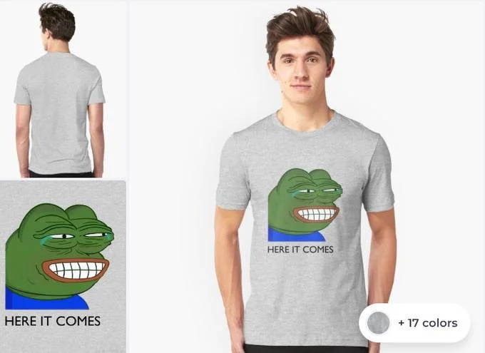 Grey t-shirt merchandise featuring PepeLaugh emote with 'HERE IT COMES' text