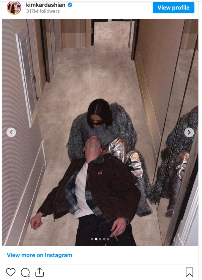 Kim Kardashian Instagram post of her lying with Pete Davidson in a mirrored hallway