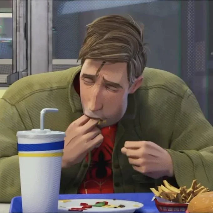 Peter B. Parker Sucking Fingers — Cropped screenshot of Peter B. Parker licking his fingers at a diner