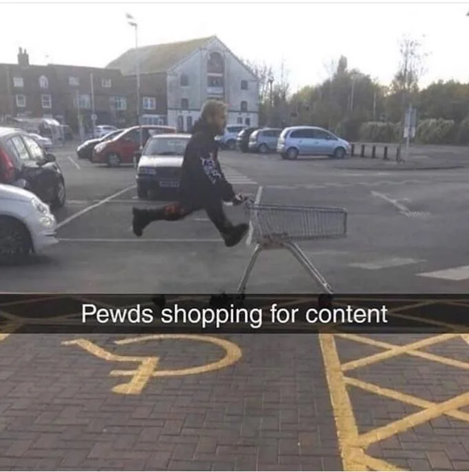 PewDiePie Shopping — Small blurry image of PewDiePie crouching next to a tipping shopping cart