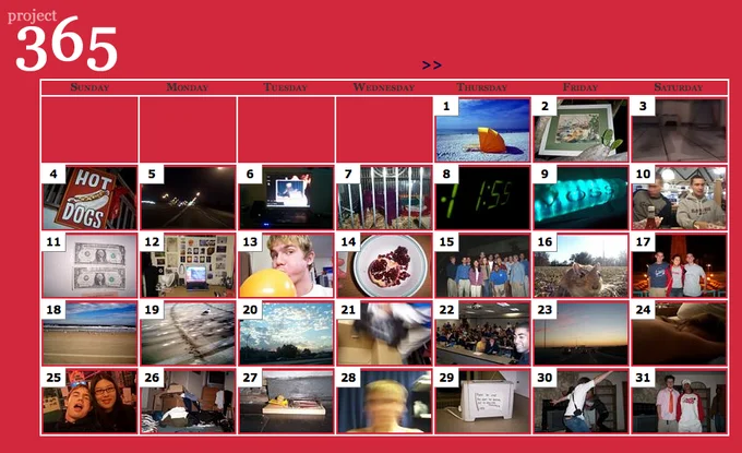 Photo A Day — A Project 365 calendar grid displaying 31 numbered daily photos in a red-themed layout with navigation arrows and varied photography.